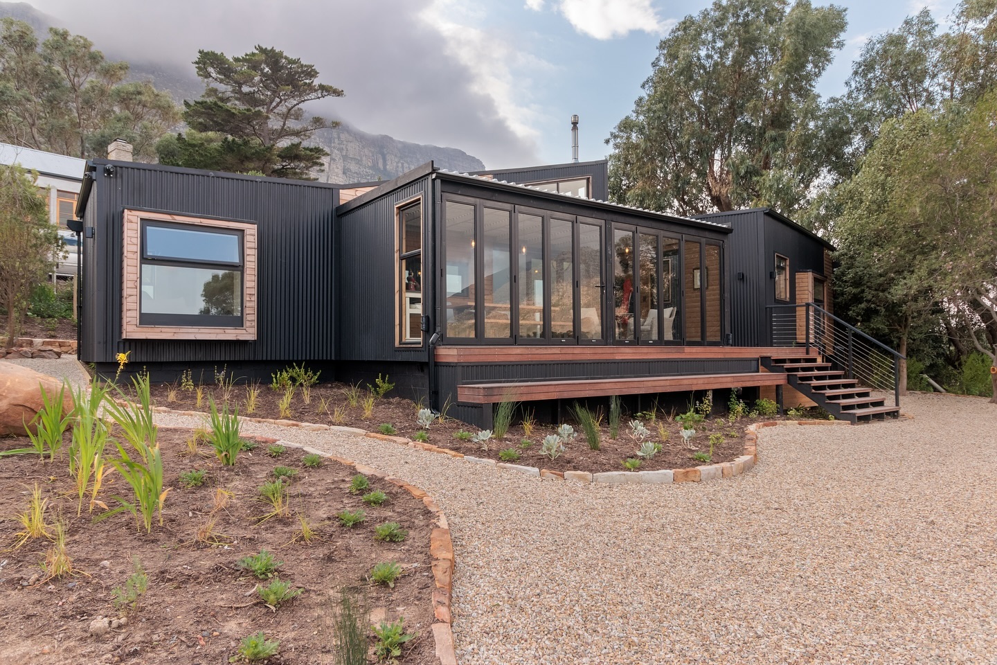House Tome | Houtbay, South Africa
Where modern design meets mountain serenity!
This timber frame beauty, with sleek matte black corrugated iron and natural timber cladding, perfectly frames the breathtaking views.
#timberframehouse #outdoorliving #residentialdesign #capetownsouthafrica #timbercladding #metalcladding #moderndesign